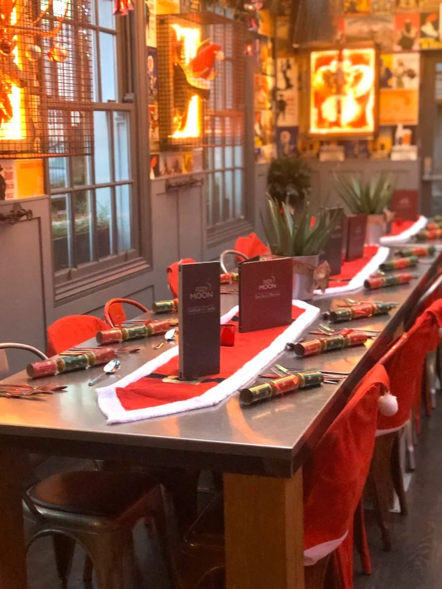 The main bar dressed for Christmas with santa table runners